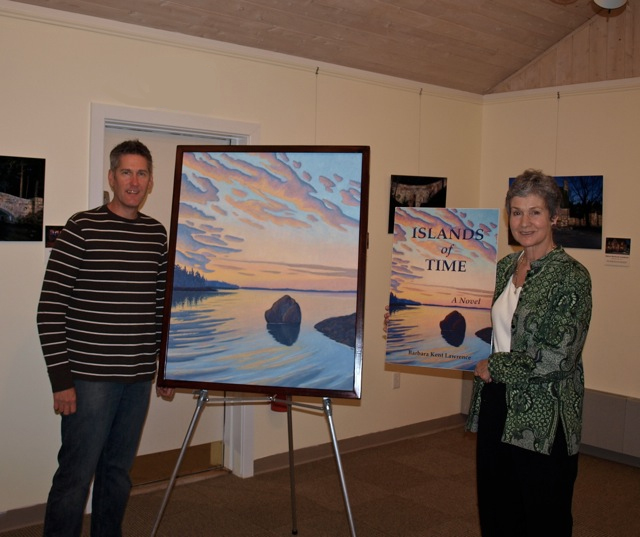 Artist Scott Baltz with his beautiful painting "Dimming Light Passing," that is the basis for the cover of Islands of Time with me in the Northeast Harbor Library for the launch of Islands of Time. Artist Scott Baltz with his beautiful painting "Dimming Light Passing," that is the basis for the cover of Islands of Time with me in the Northeast Harbor Library for the launch of Islands of Time.
